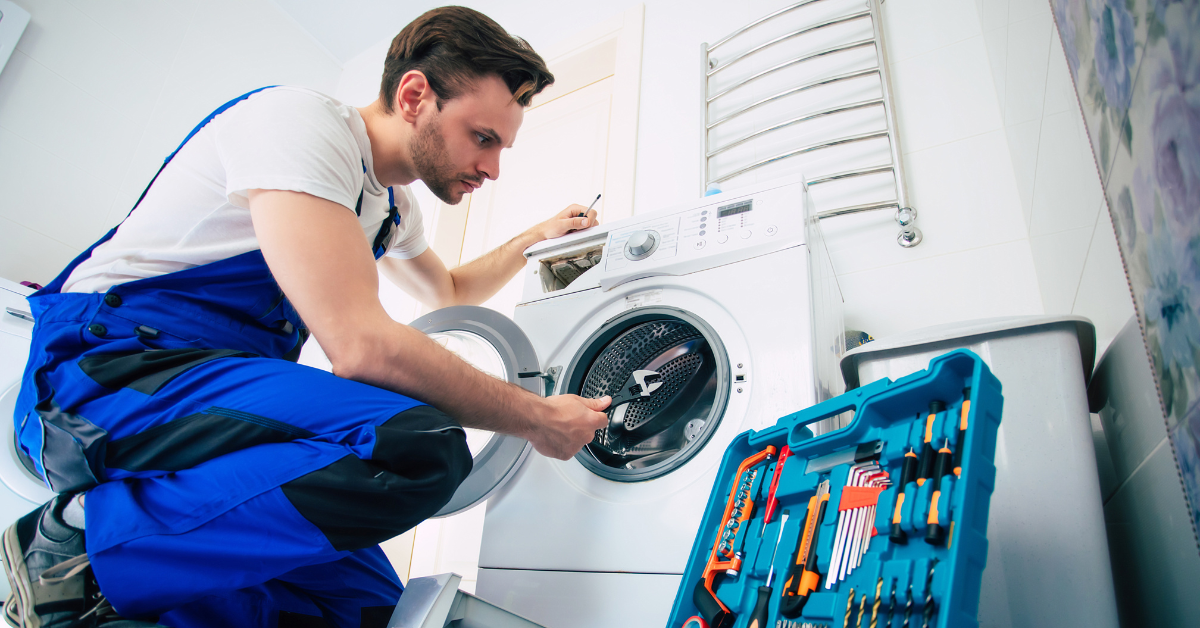 Technician repairing a washing machine